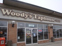 Store front for Woody's Tap House